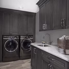 The Brookhaven II Laundry uses maple wood and a slate finish. Cabinets crafted in Michigan since 1958.